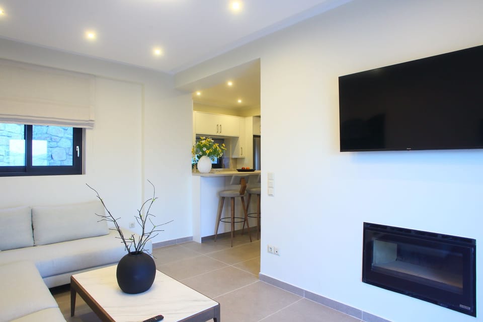 Open plan living area, with smart tv, leading out to the pool area.