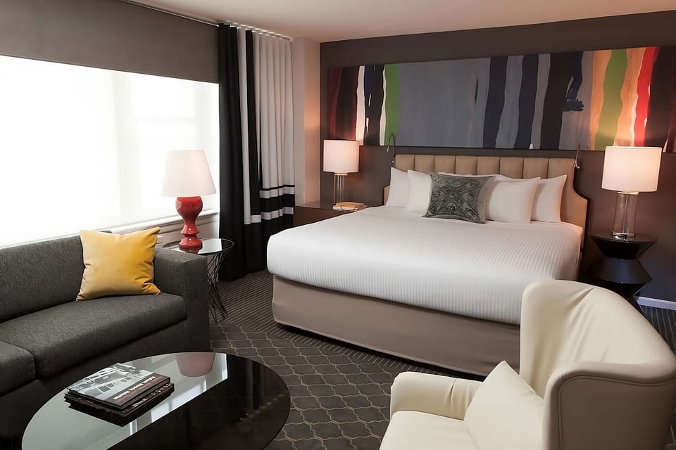 Lounge in a spacious room with cozy seating and soft light.