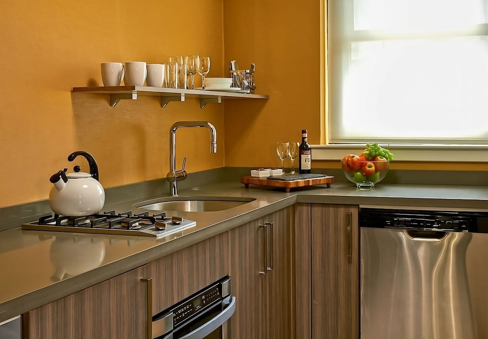 Sip coffee and prep meals in a warm, stylish kitchen.