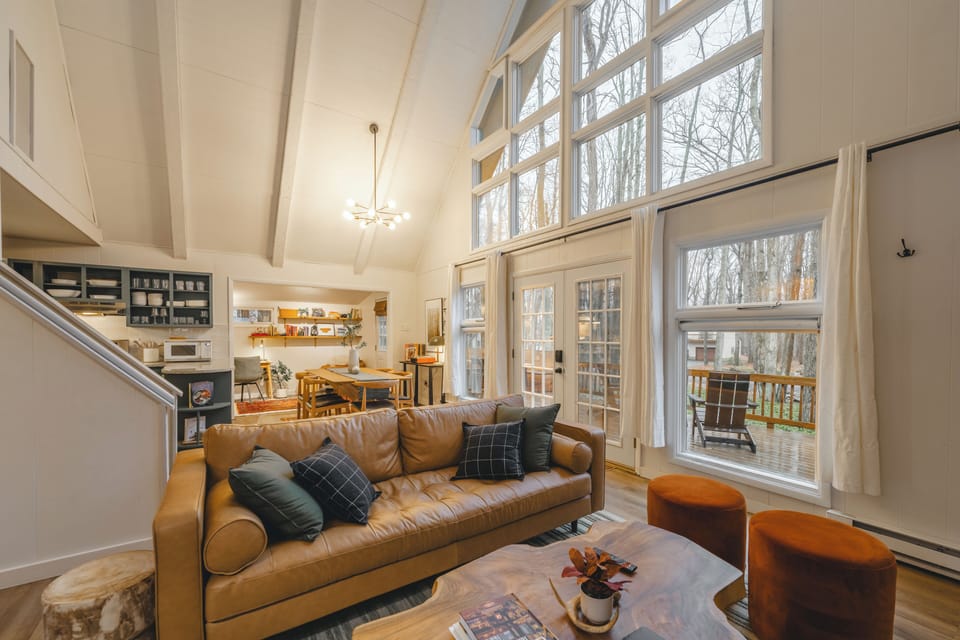Oh, those windows!  The 2- story peaked roof makes the cottage feel like an A-frame on the inside.