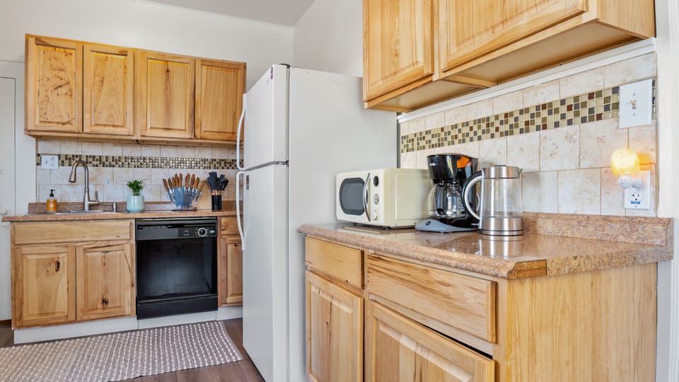 Plenty of Cupboards and Drawers, Coffee Maker, Microwave, and Water Pitcher