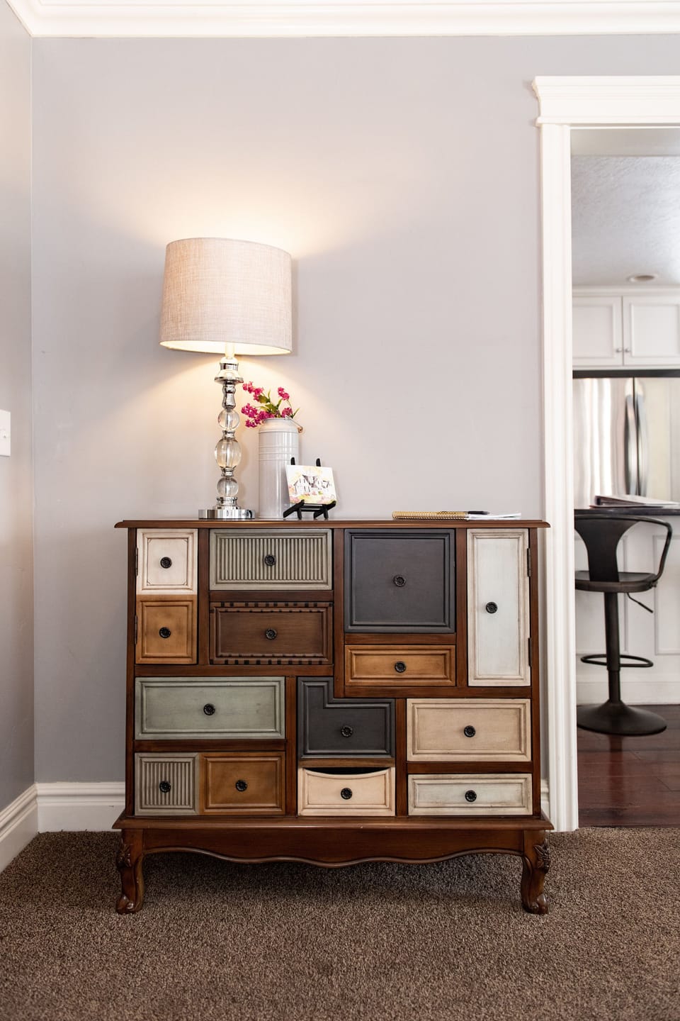 A large beautiful family room with fireplace, comfortable couches and flatscreen TV.  French doors lead to the upper deck and spa areas