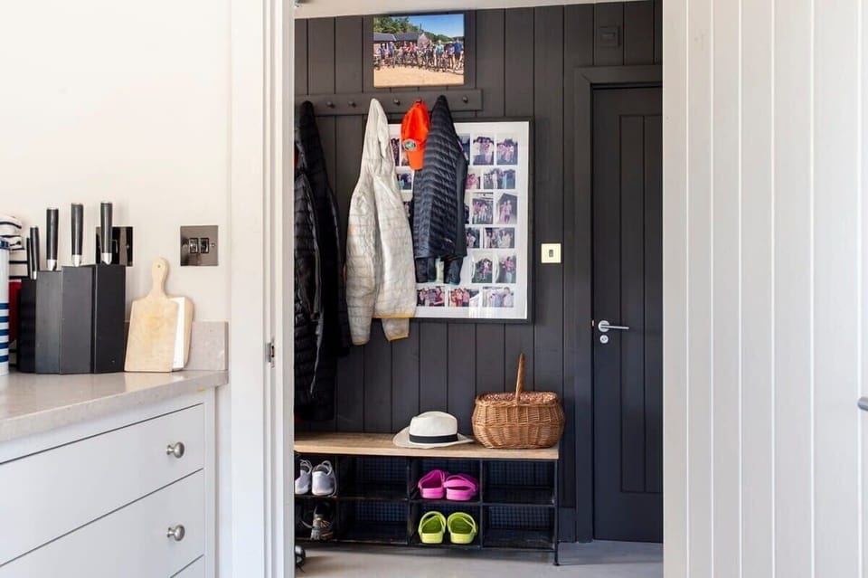 There is a handy boot room to the side of the home for your coats and shoes.