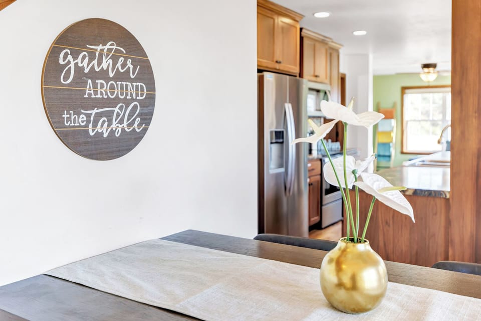 Kitchen - fridge, oven, stove, microwave, dishwasher, bar seating,  table seating.