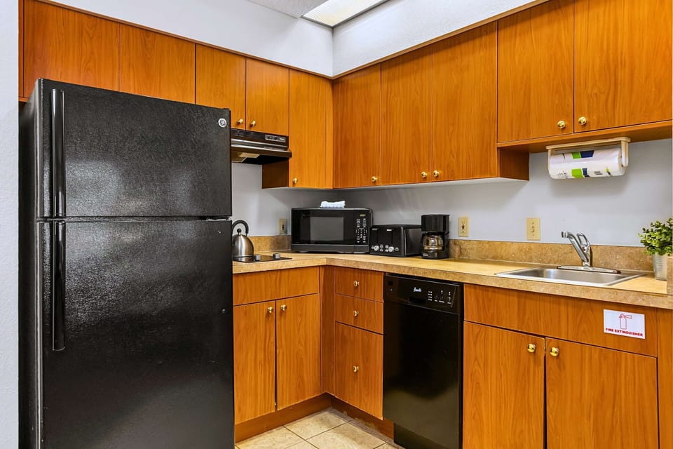 Whip up quick bites or brew fresh coffee in this sleek kitchen space.