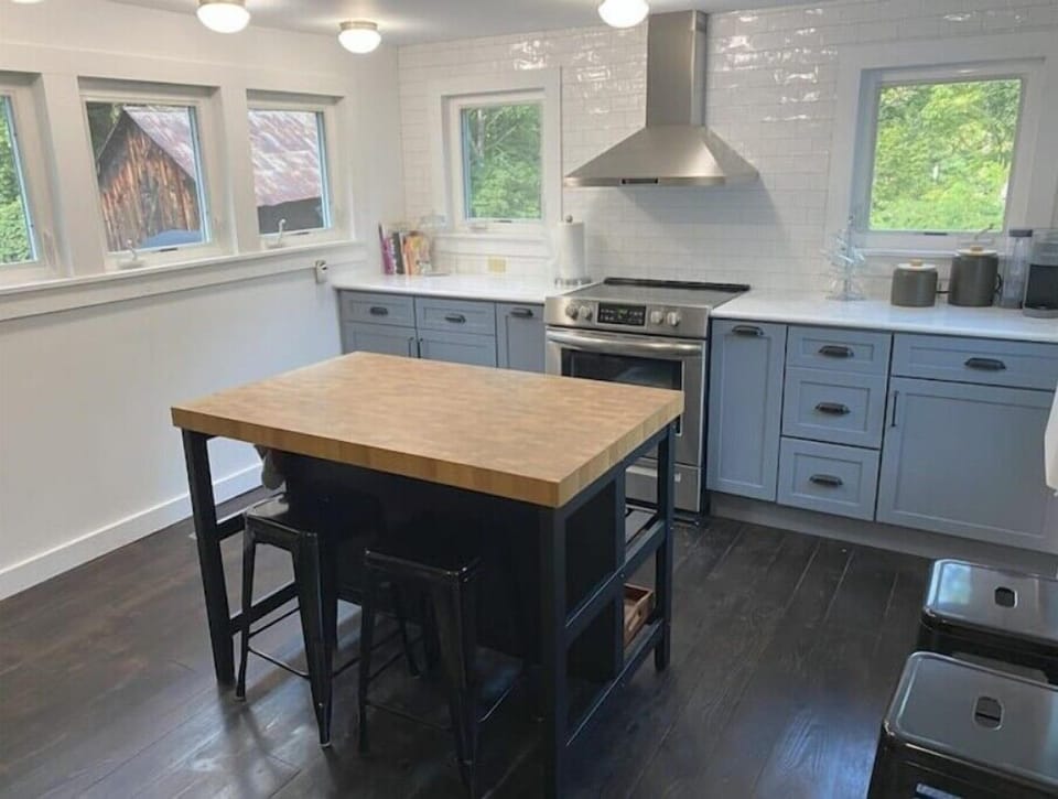 Large kitchen workspace stocked with cooking necessities, Keurig coffee, and tea