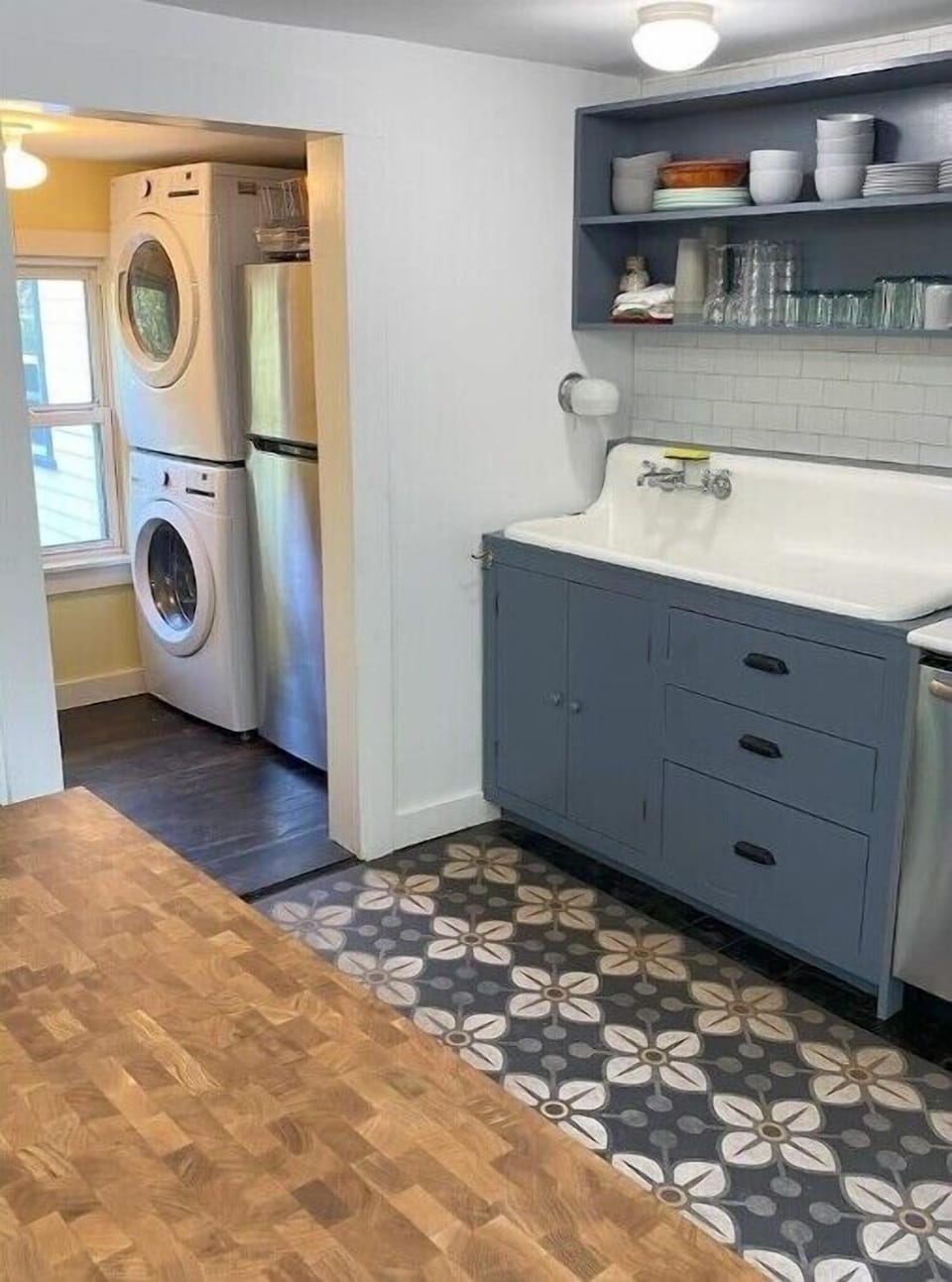 Pantry includes full-sized washer and dryer, hoosier, and fridge.