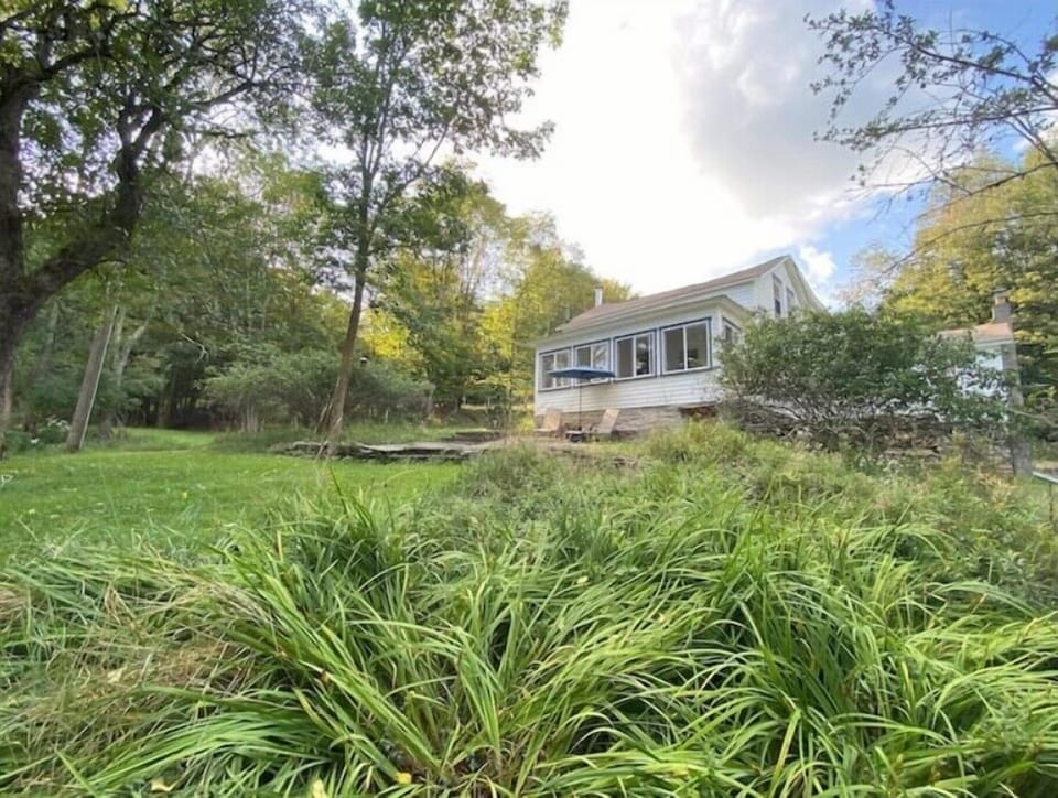 Grass-filled yards and gardens surround the property.
