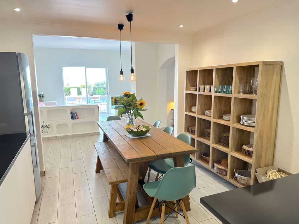 Dining area in front of the kitchen with view to the pool
