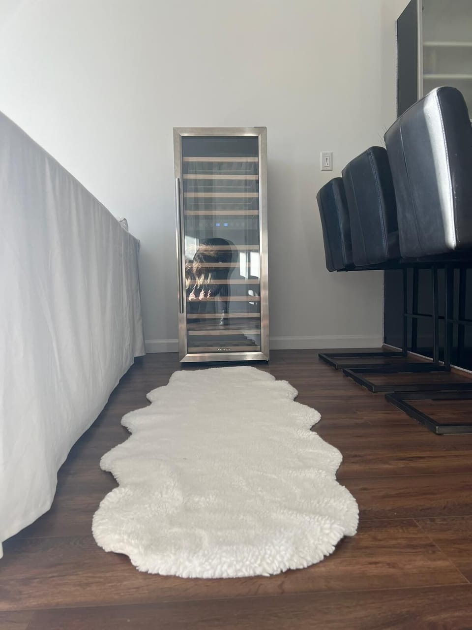 Wine cooler for wine lovers tucked into a dedicated hallway storage nook!