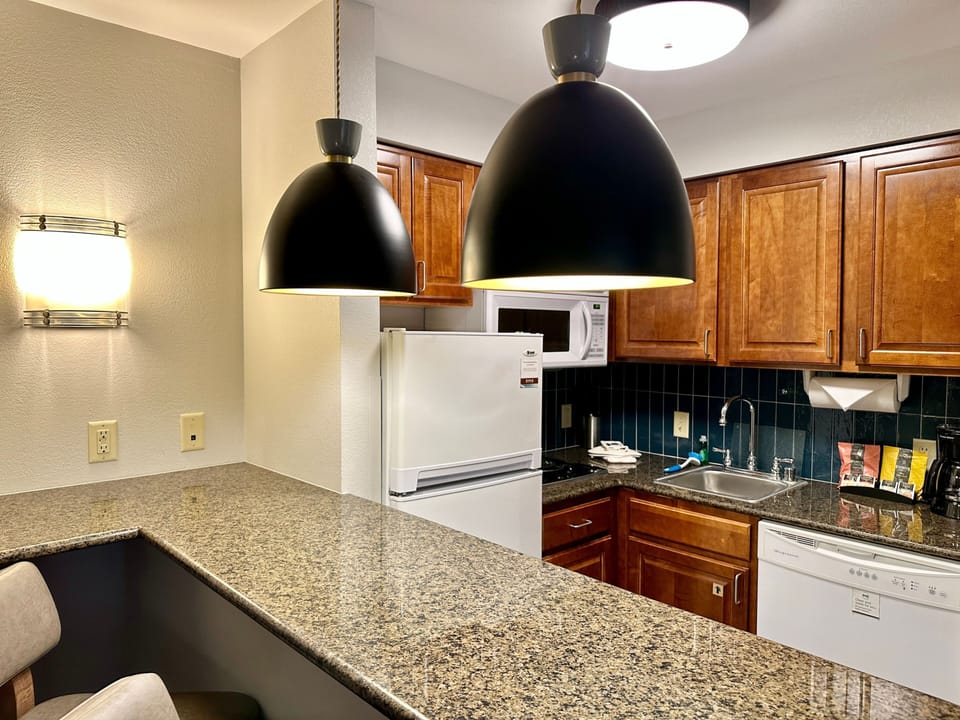 Full kitchen with ample counter space and modern appliances.