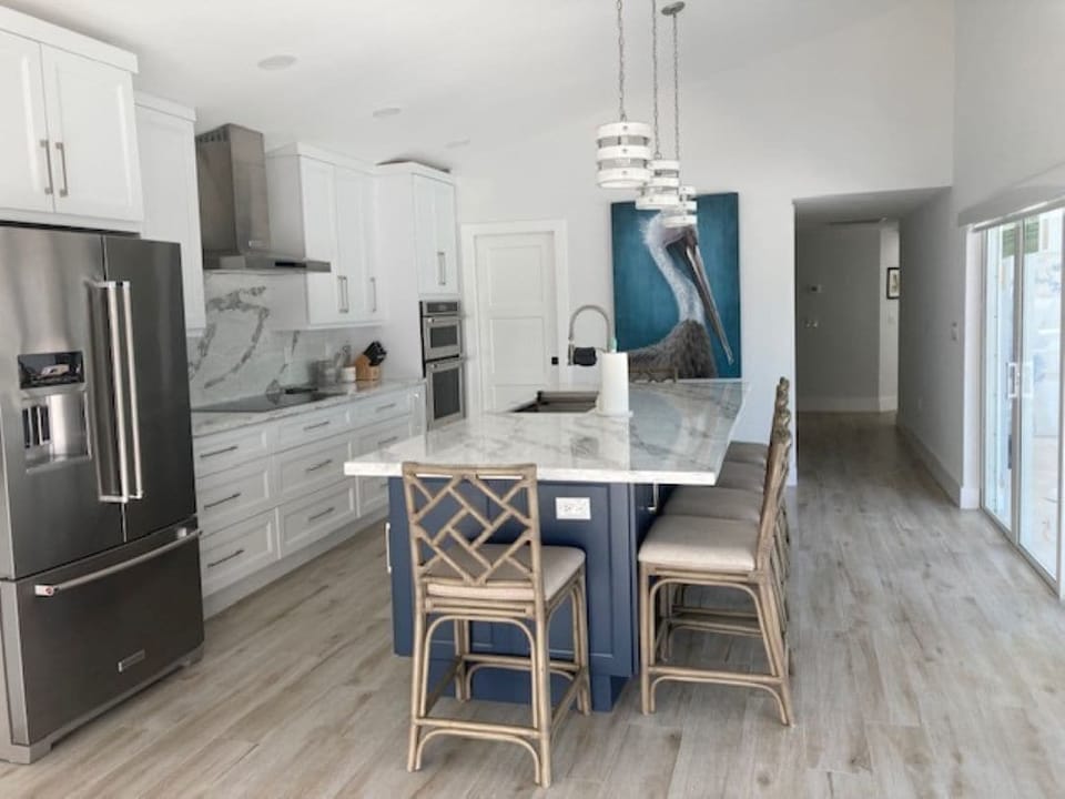 Large kitchen.  Island sits comfortably.