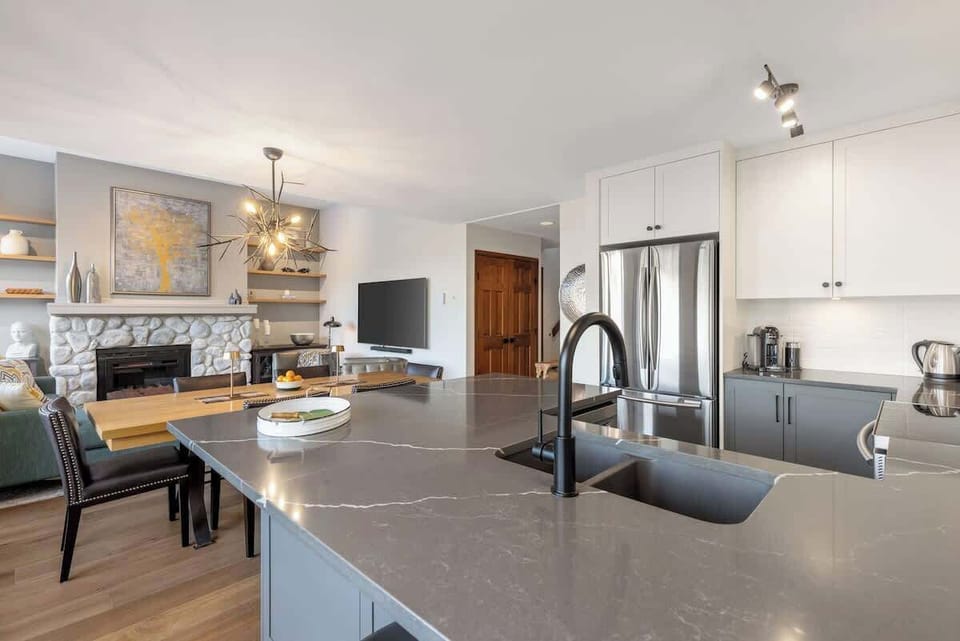 - Spacious open-concept kitchen and living area designed for entertaining and comfort  
- Enjoy seamless flow from cooking to lounging with mountain views in sight  
- Gather with friends and family in this inviting Whistler getaway space