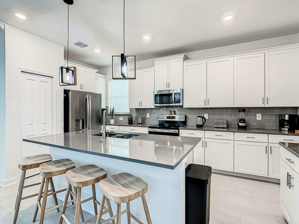 Modern Kitchen with Island Seating and Stainless Appliances