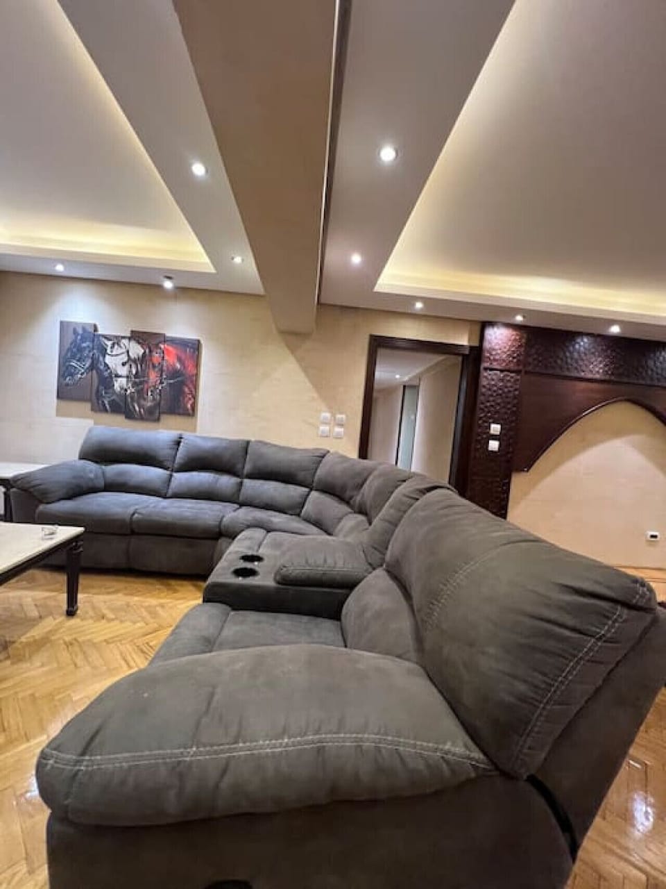 Step into comfort with our spacious, well-appointed living room, perfect for relaxation or entertaining. Featuring plush seating, elegant lighting, and chic decor, it's the ideal retreat after a day of city exploration!