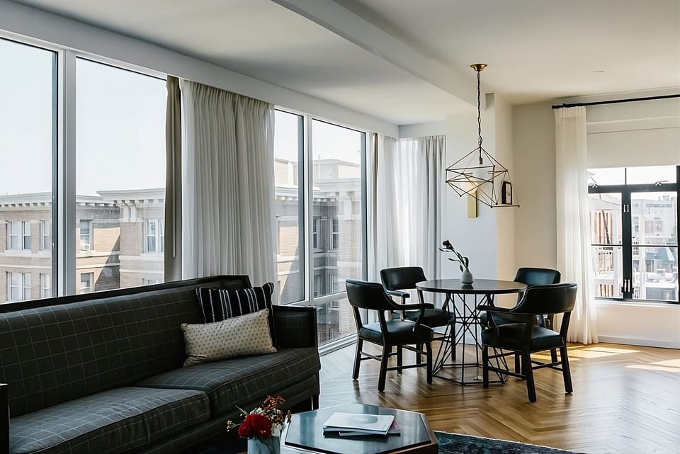 Gather for meals beside sweeping windows and relaxed lounge seating.