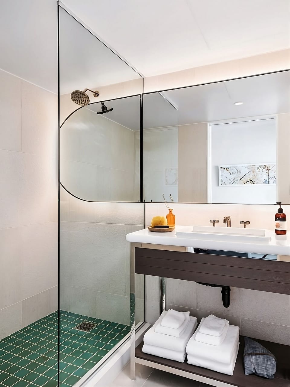 Step into a bright shower space with fresh towels ready.