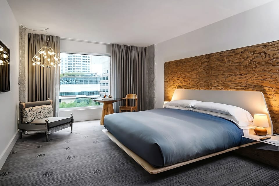 Stretch out in a serene room with warm designer lighting