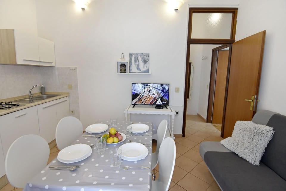 The kitchen, dining table and sofa