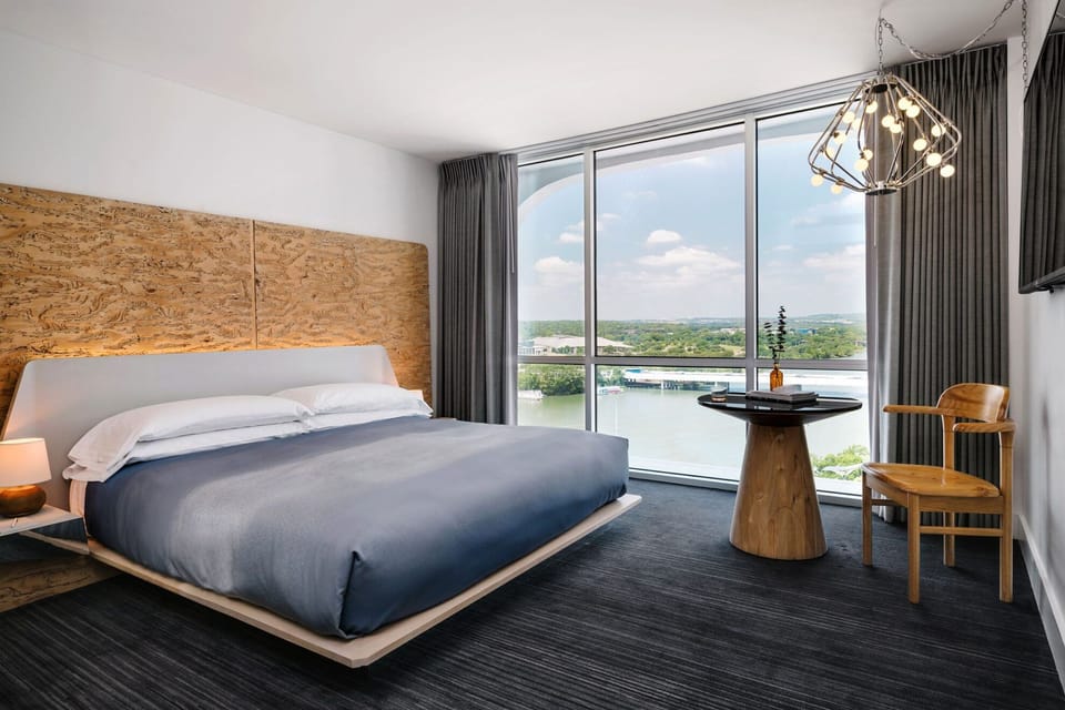 Wake up to sweeping river views from a plush bed