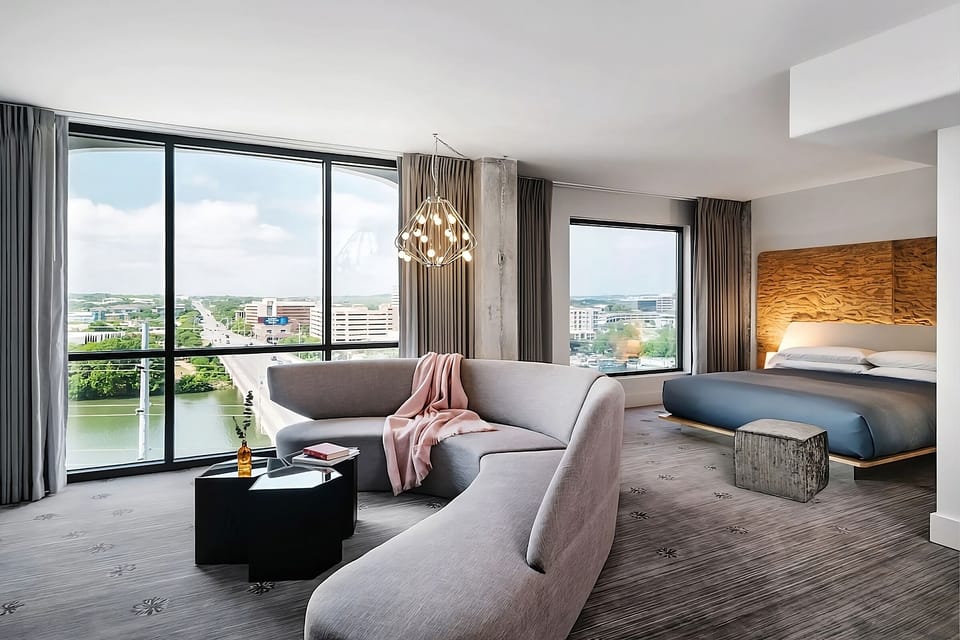 Lounge with panoramic views and a cozy, suite-like layout.