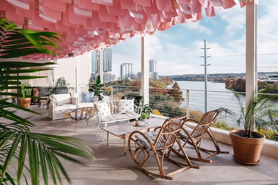 Sip cocktails under a canopy with skyline-and-lake panoramas