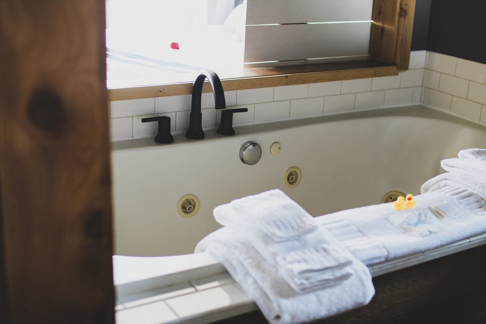 Soak and unwind in a deep tub with fluffy robes