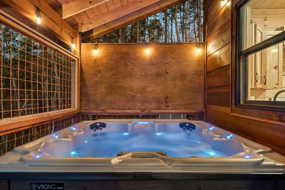 Private spa glowing after dark — unwind under the mountain sky.
