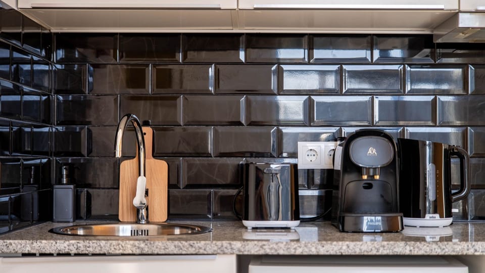 Our kitchenette is equipped with high-quality appliances #sleek #elegant