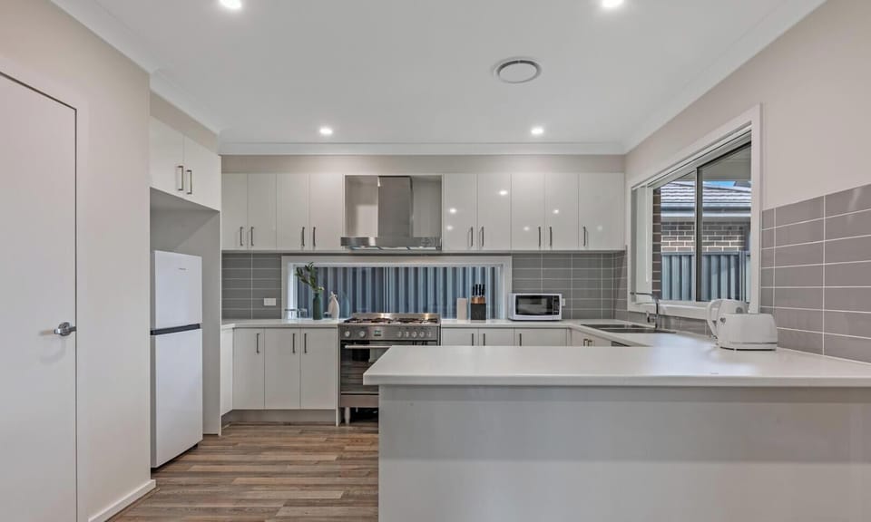 Spacious breakfast bar and ample counter space for effortless meal preparation.