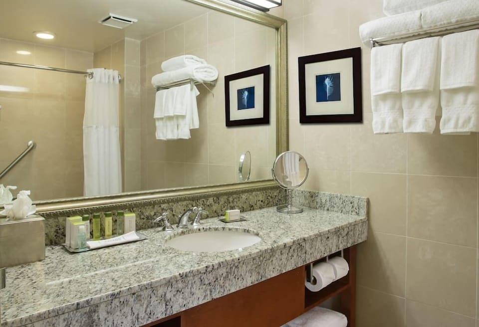 Refresh comfortably with bright lighting, plush towels, and amenities.