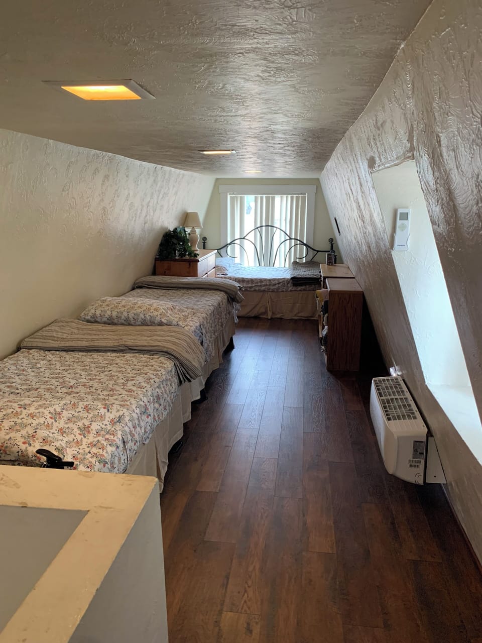 Upstairs with three twin beds.