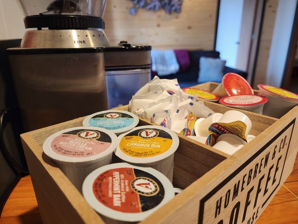 K-cups, creamer, sugar and tea are provided.