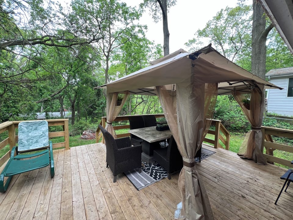 Newly built back porch with dinning table and canopy