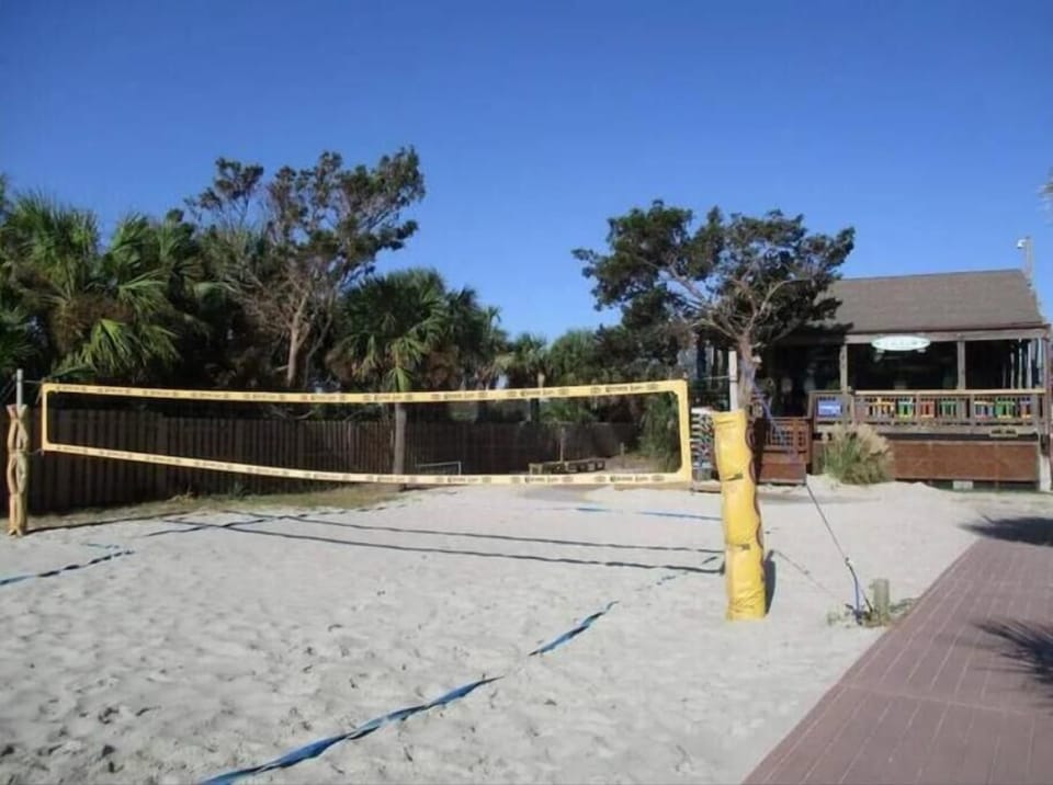 Sandy volleyball court and Coco's