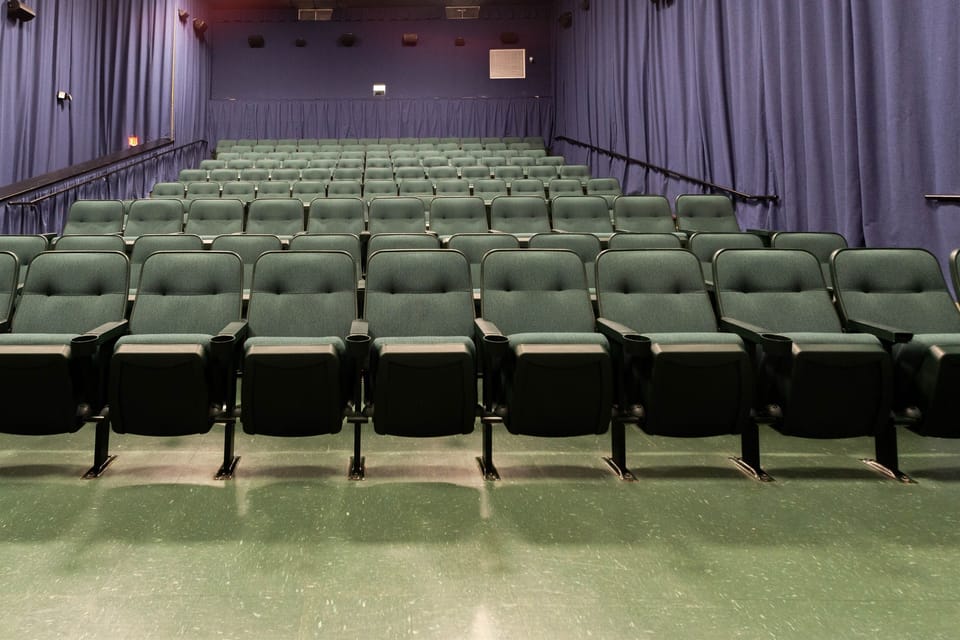 Plenty of comfy seating in the theater on floor 4 of the Amenities Bldg