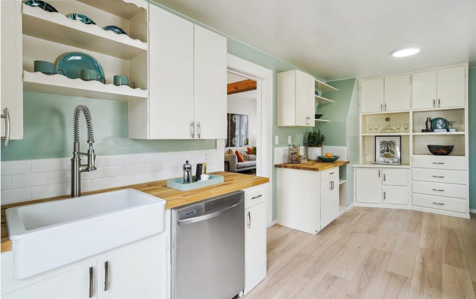 Kitchen sink, espresso machine, toaster, and countertop