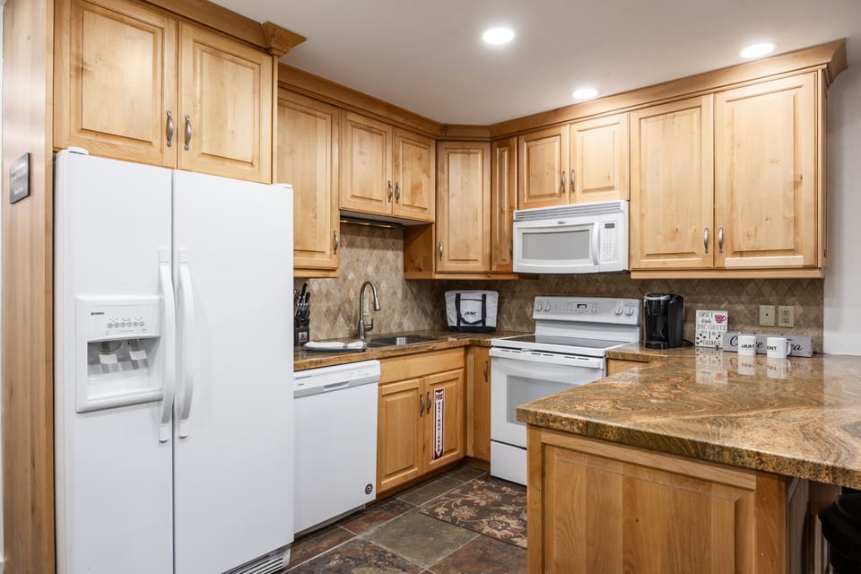 - Spacious kitchen with updated appliances  
- Granite counters and ample wood cabinetry  
- Perfect for cooking after mountain adventures