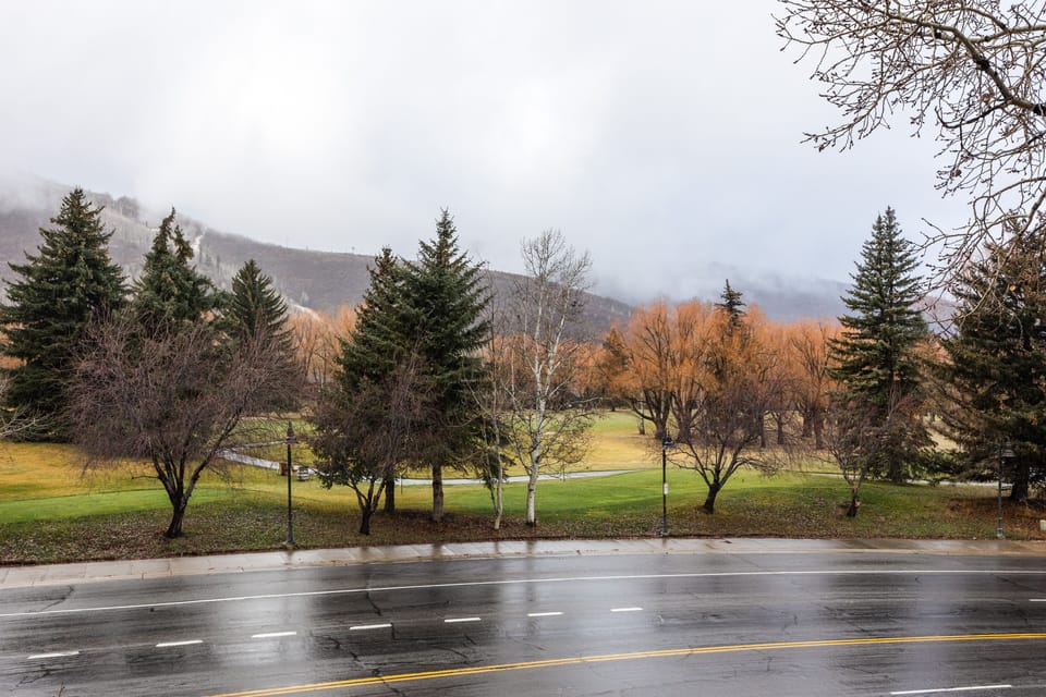 - Scenic view of trees and mountains from balcony  
- Golf course and slopes visible year-round  
- Relax with alpine beauty from your private deck
