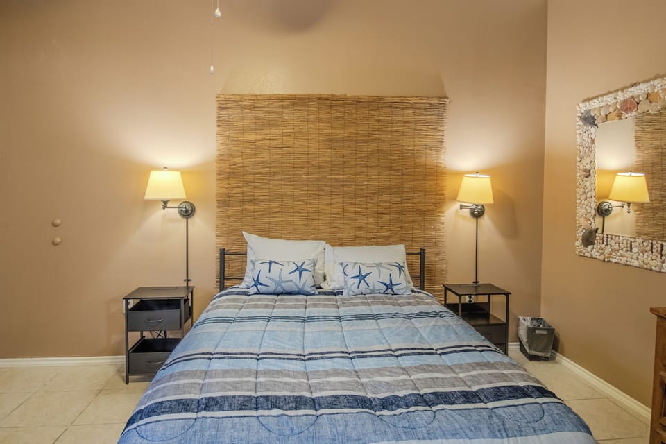 This private suite features a comfortable queen bed for added privacy.