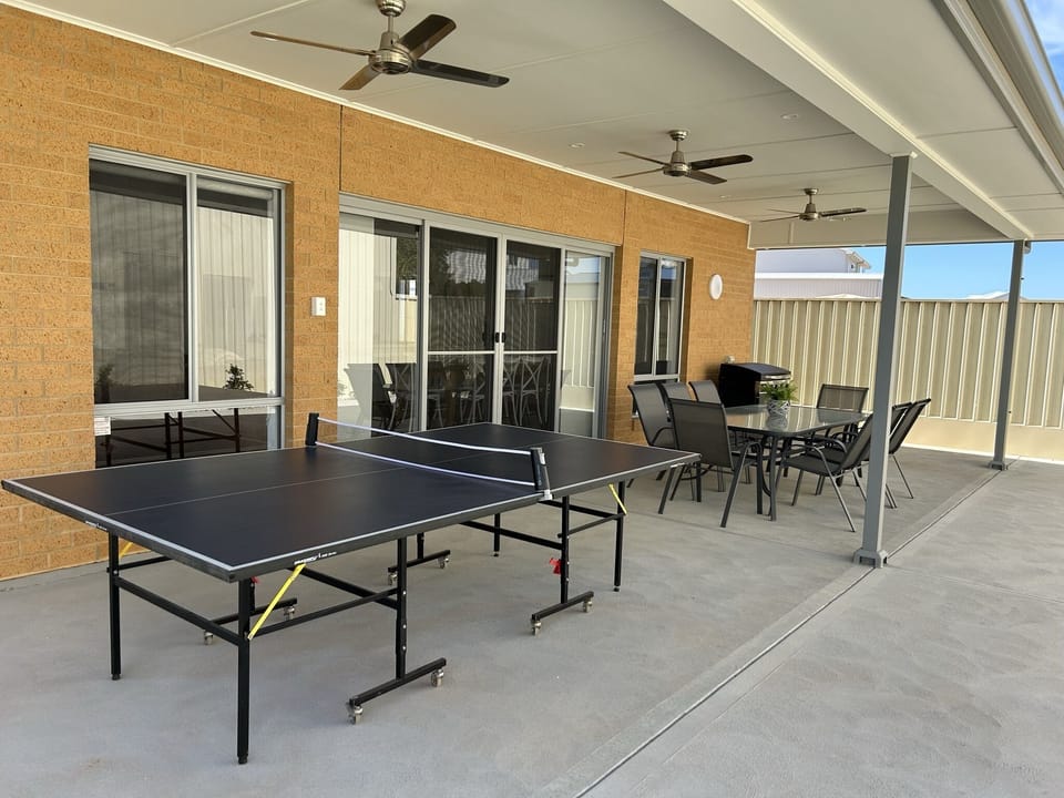 Spacious alfresco area with gas BBQ, 8 seater dining with extra table & 4 chairs