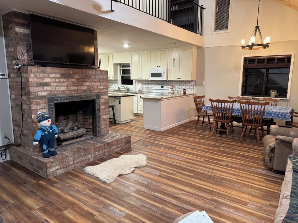 living/dining room with couch, 3 recliners. Additional leaf can be added 