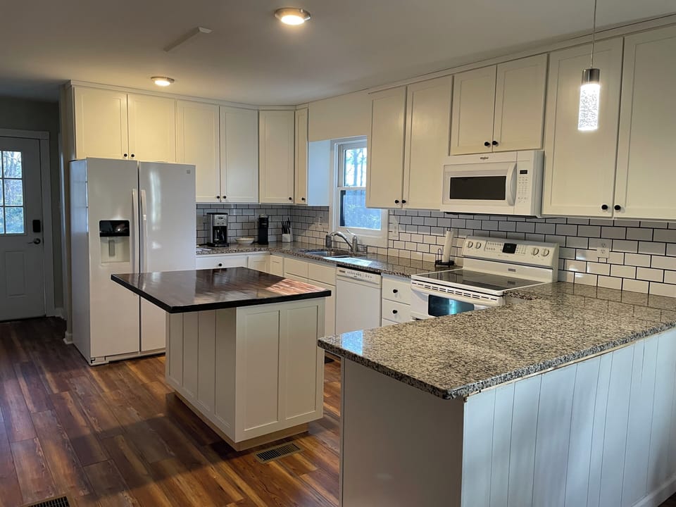 Newly remodeled kitchen (2 barstools not shown)