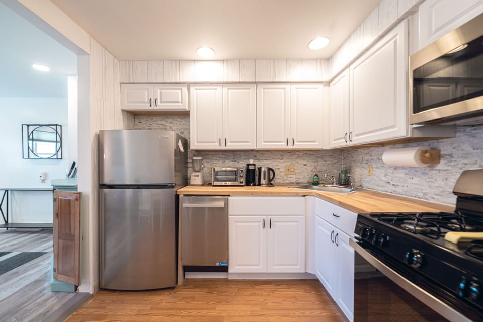 Stainless refrigerator, dishwasher and gas range/oven