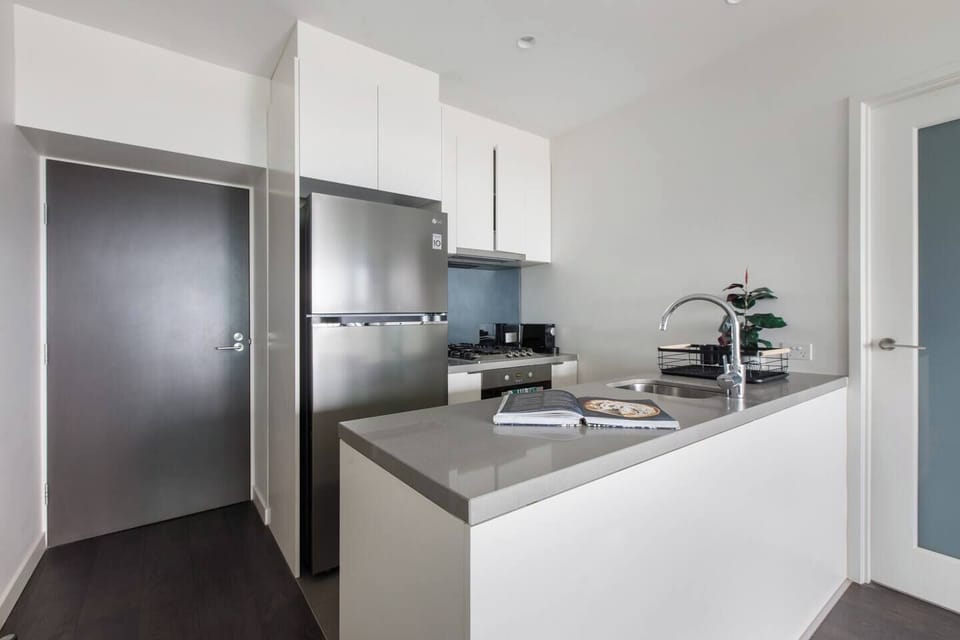 The kitchen comes well equipped for meals at home, with sleek appliances and cooking utensils