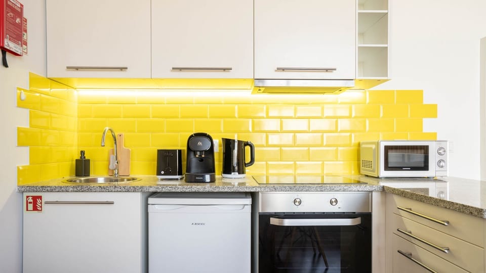 Our kitchenette is equipped with all the essential appliances like a mini-fridge, microwave, and coffee maker. It's ideal for preparing light meals and snacks during your stay #functional #compact