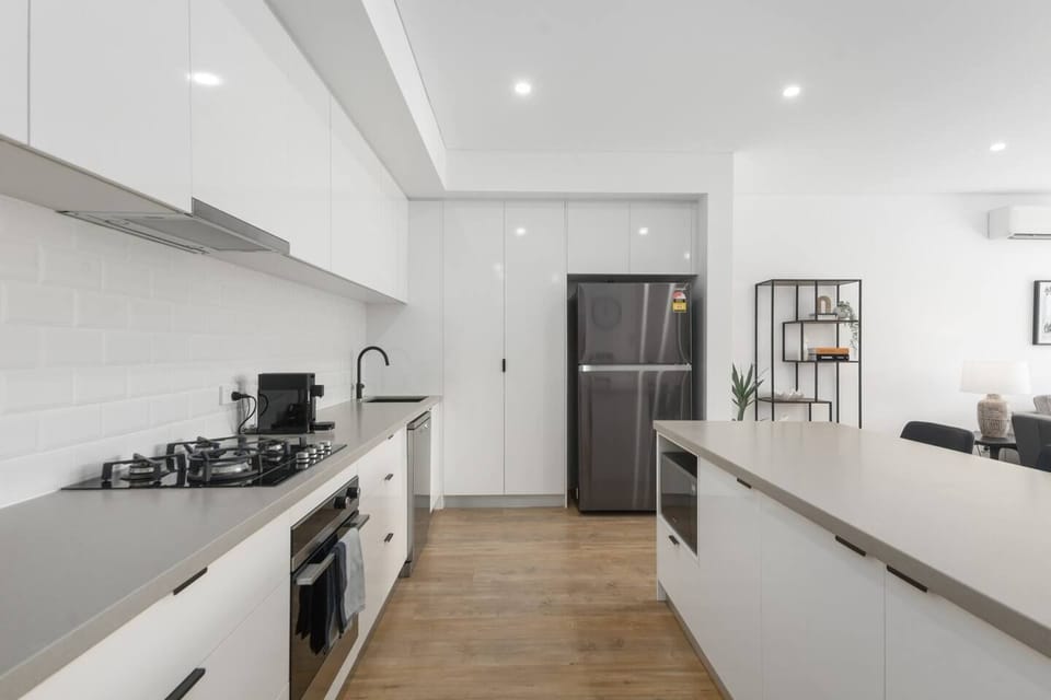 The gourmet kitchen is stunningly modern, housing with premium appliances and all the essentials needed to whip up a meal at home.
