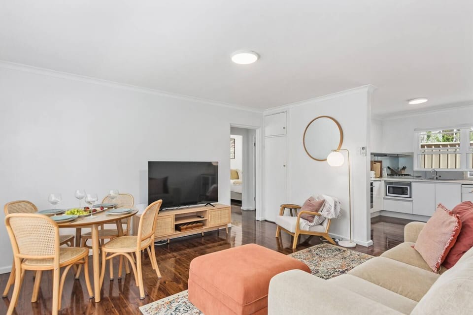 The lounge area is beautifully appointed with a plush sofa, armchair and TV for movie nights at home.