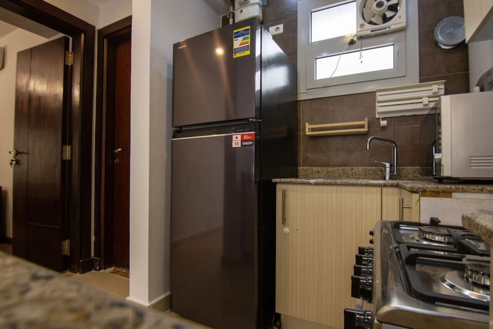 Fridge, microwave, oven, cookware/dishes/utensils