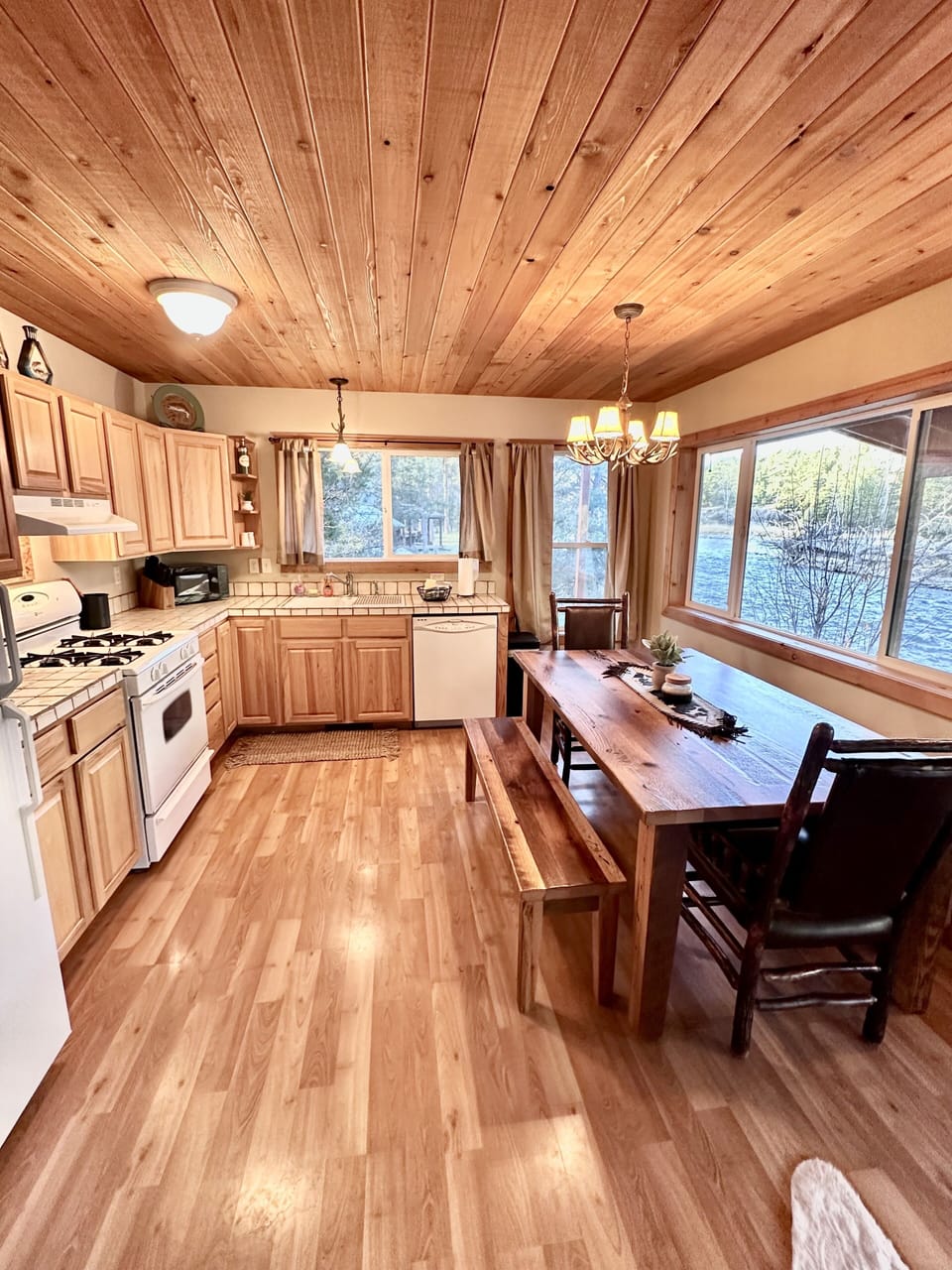 Well appointed kitchen with large table for family or friends to gather.